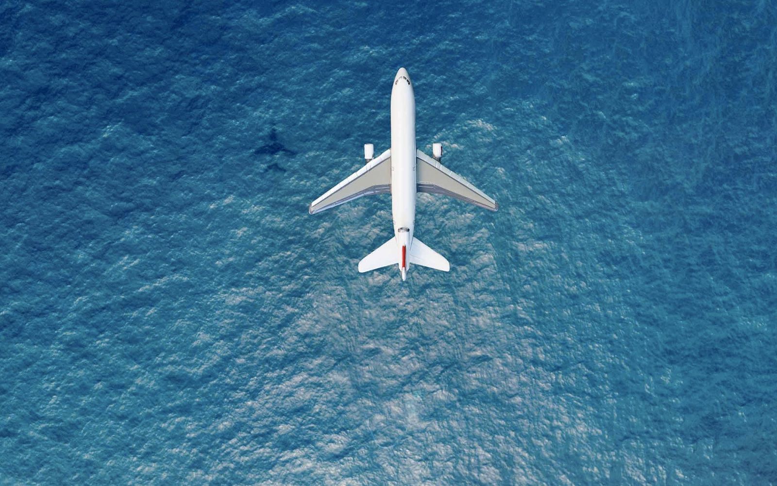 Airplane Flying Over Ocean