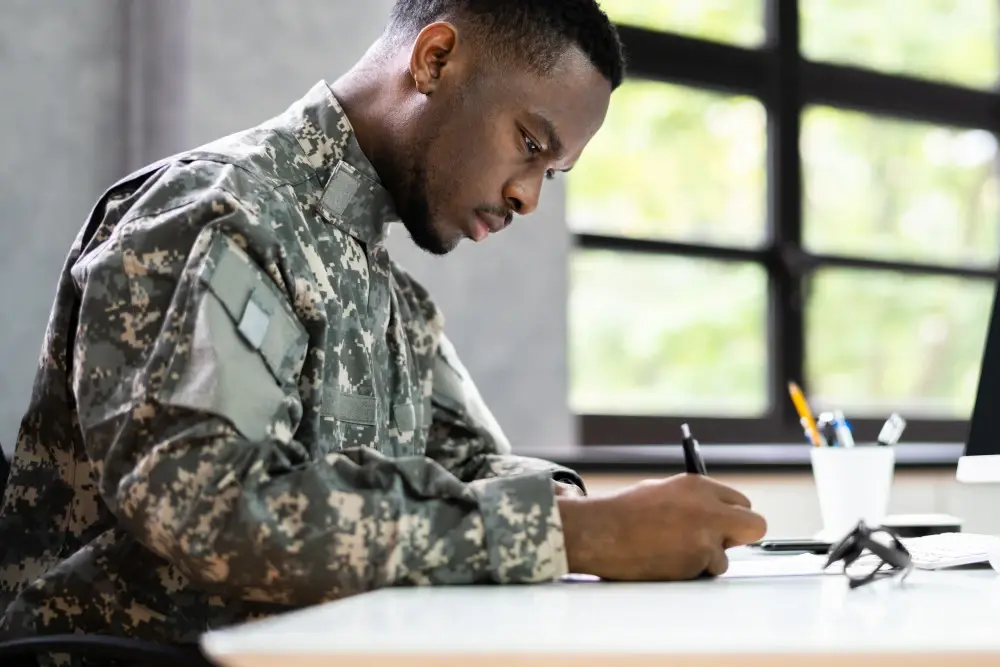 A veteran man writing down symptoms for his c&p exam.